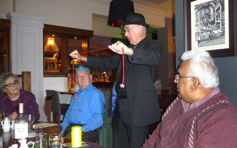 Magician Pat Kiely at the Caring Café Christmas Meal