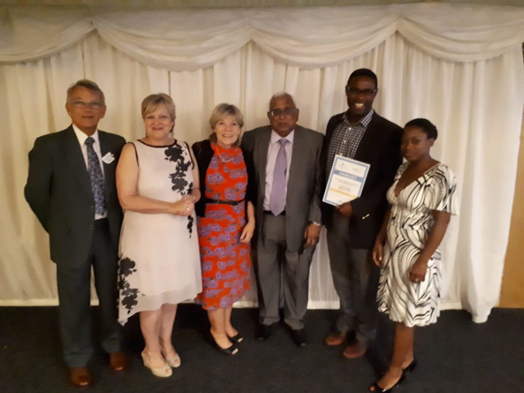 caring cafe receiving certificate at carer's trust award night