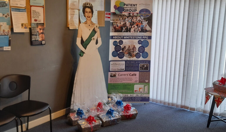 Surgery display with some gifts and a picture of Queen Elizabeth II